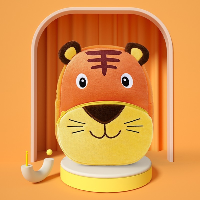 Plush children’s kindergarten backpacks featuring cute animal designs including a ladybug, cow, bunny, tiger, and butterfly, displayed on colorful blocks.