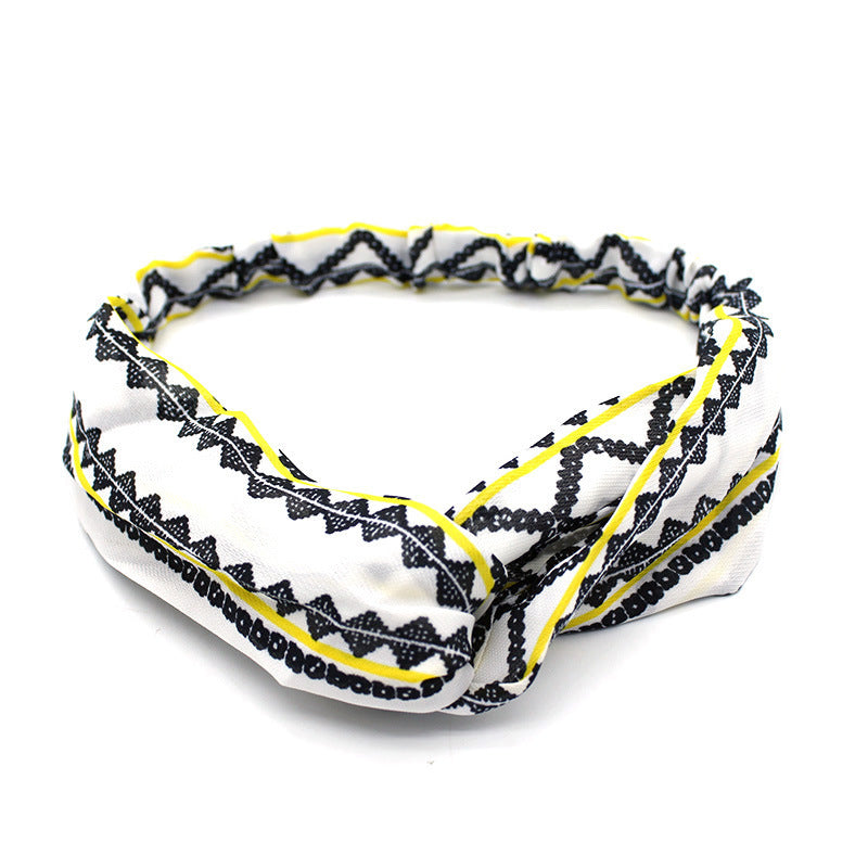 Ladies cross-knotted wide-brimmed headband with a fabric flower, perfect for adding a stylish and elegant touch to any outfit.