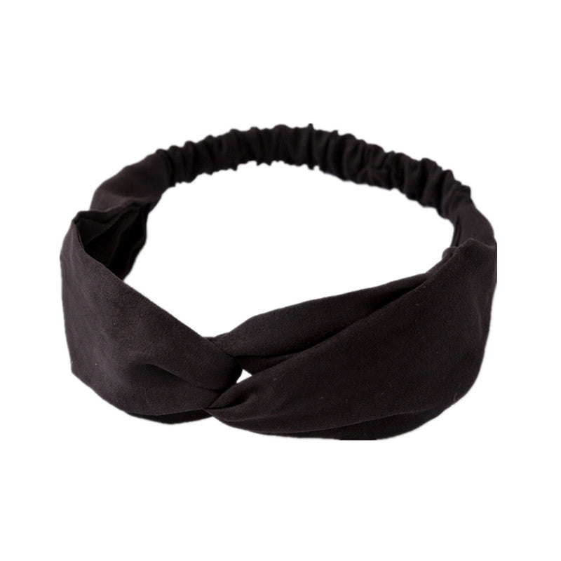Ladies cross-knotted wide-brimmed headband with a fabric flower, perfect for adding a stylish and elegant touch to any outfit.