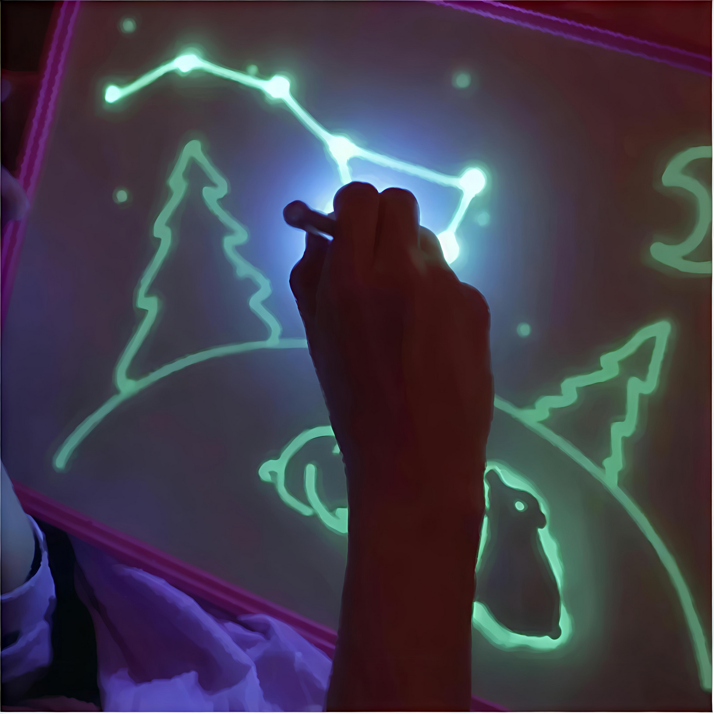 Child using a glowing light drawing tablet to sketch a boat, sun, and birds—educational toy for creative play, early learning, and sensory development.