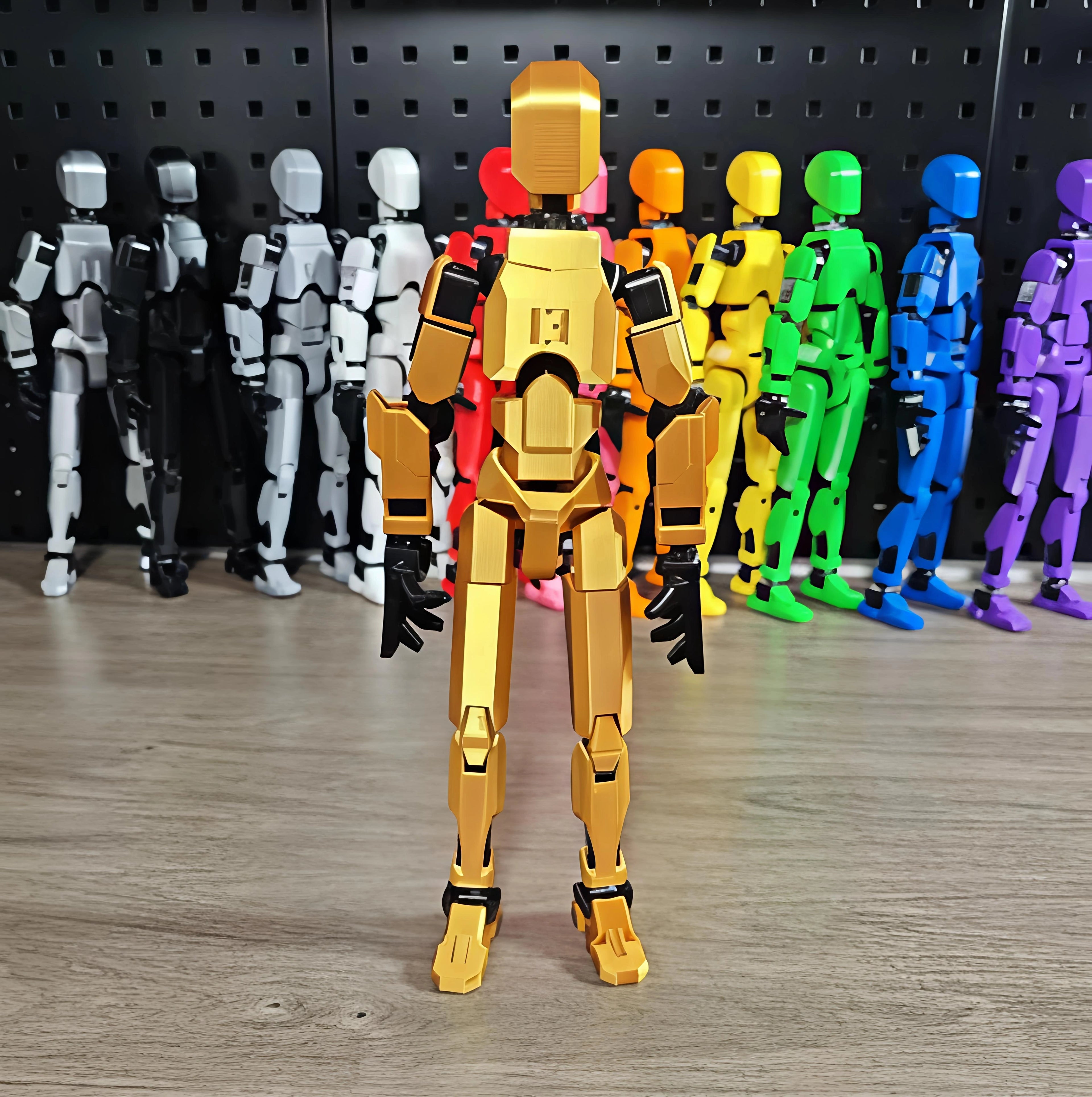 Gold robot figure in front of a row of multicolored robot figures on a wooden floor.