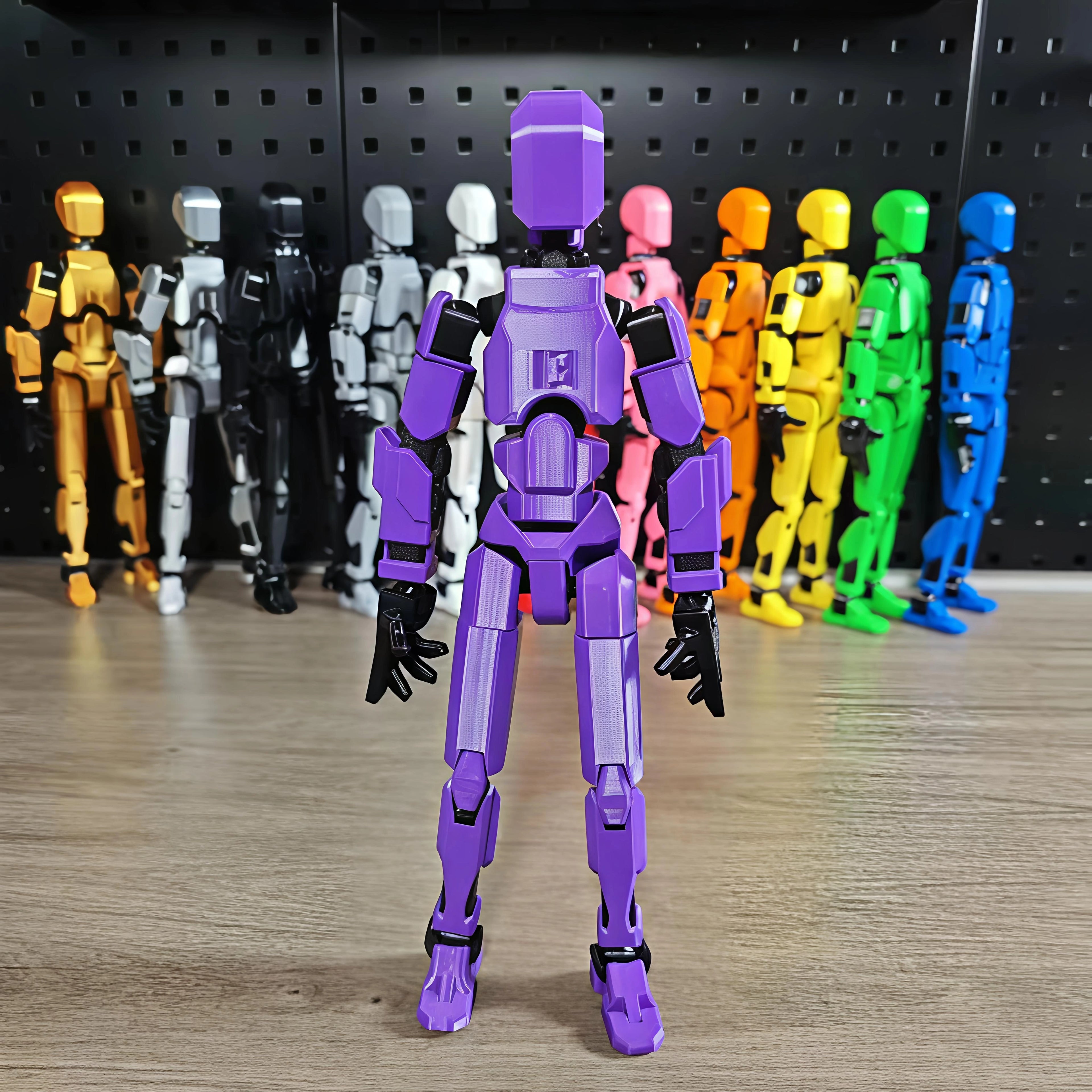 Purple robot toy in front of a row of multicolored robot toys on a wooden surface.