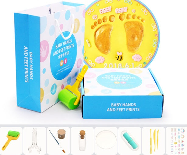 A vibrant set of baby hand and foot print mud or clay kits, designed for newborns, displayed with colorful plaques and decorative elements. Perfect for creating lasting keepsakes, this product is available exclusively on Giggly Groves Toy Website.
