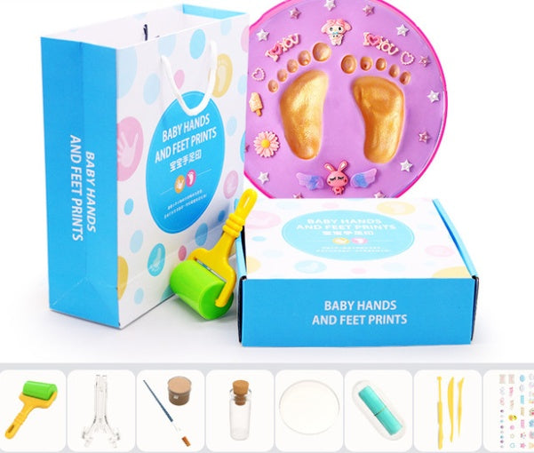 A vibrant set of baby hand and foot print mud or clay kits, designed for newborns, displayed with colorful plaques and decorative elements. Perfect for creating lasting keepsakes, this product is available exclusively on Giggly Groves Toy Website.