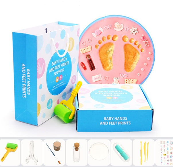 A vibrant set of baby hand and foot print mud or clay kits, designed for newborns, displayed with colorful plaques and decorative elements. Perfect for creating lasting keepsakes, this product is available exclusively on Giggly Groves Toy Website.