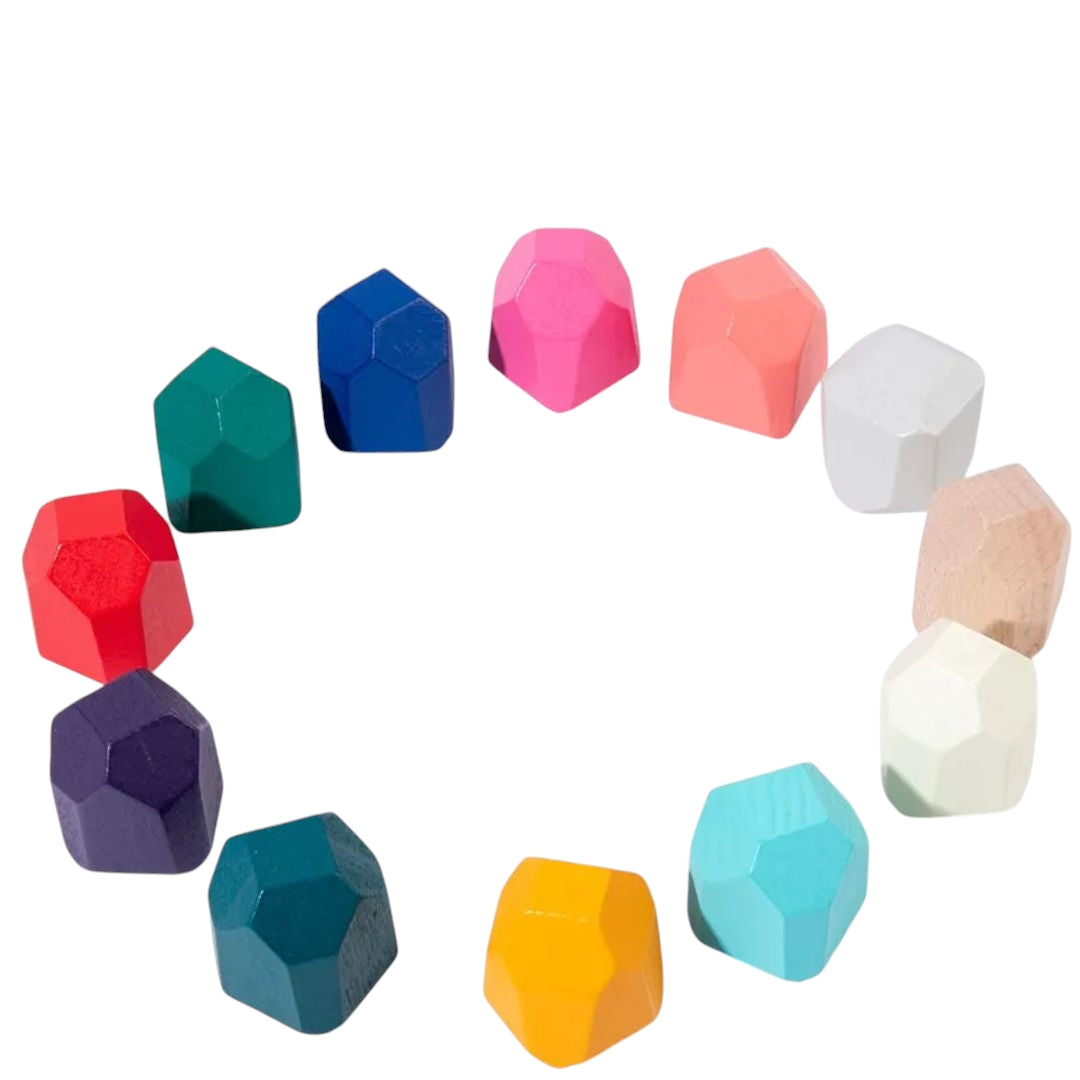 Four stacks of colorful, faceted wooden blocks designed for kids, featuring a variety of shapes and bright colors like orange, turquoise, purple, and red. Perfect for imaginative play and developing motor skills.