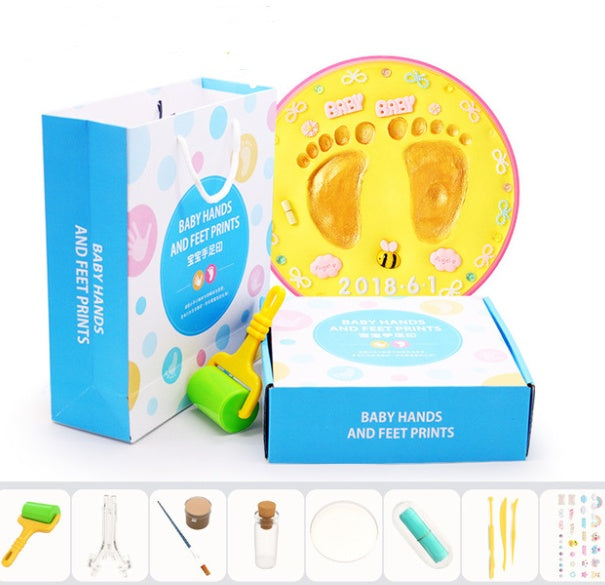 A vibrant set of baby hand and foot print mud or clay kits, designed for newborns, displayed with colorful plaques and decorative elements. Perfect for creating lasting keepsakes, this product is available exclusively on Giggly Groves Toy Website.