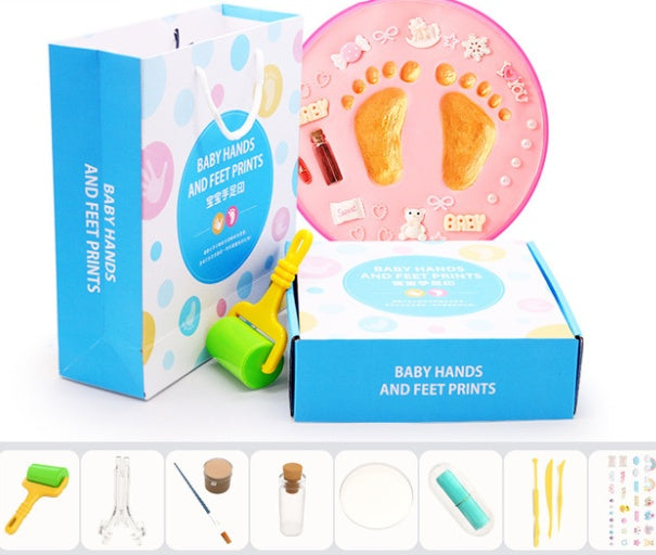 A vibrant set of baby hand and foot print mud or clay kits, designed for newborns, displayed with colorful plaques and decorative elements. Perfect for creating lasting keepsakes, this product is available exclusively on Giggly Groves Toy Website.