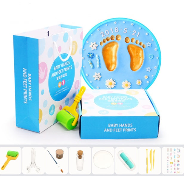 A vibrant set of baby hand and foot print mud or clay kits, designed for newborns, displayed with colorful plaques and decorative elements. Perfect for creating lasting keepsakes, this product is available exclusively on Giggly Groves Toy Website.