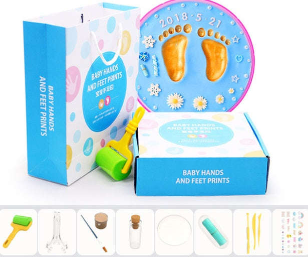 A vibrant set of baby hand and foot print mud or clay kits, designed for newborns, displayed with colorful plaques and decorative elements. Perfect for creating lasting keepsakes, this product is available exclusively on Giggly Groves Toy Website.