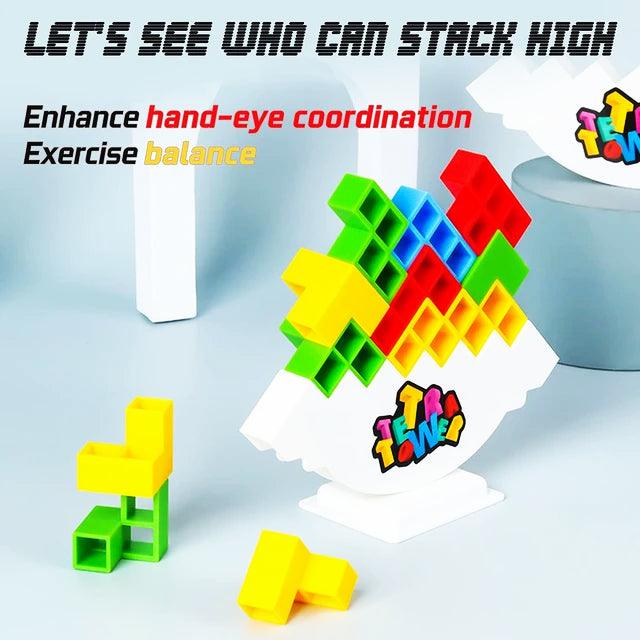 Image of a colorful 48-piece stacking toy for kids named 'Hot High Swing Russian Balancing Blocks'. The toy features vibrant hollow blocks in green, blue, red, and yellow, stacked on a white balancing base. A hand is shown placing a blue block onto the stack. Fun and educational, this table toy is available on Giggly Groves.
